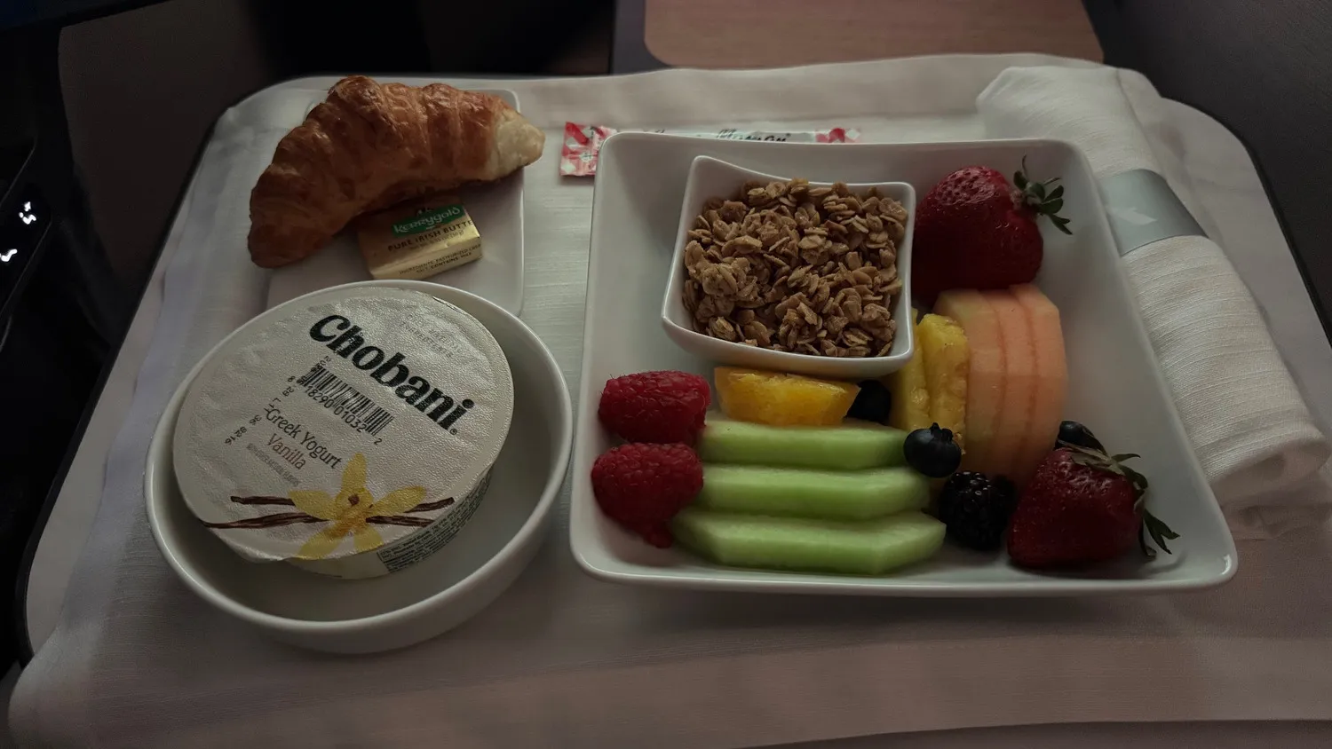 Fresh fruit, Greek yogurt, granola and a croissant: a lovely way to start the morning.