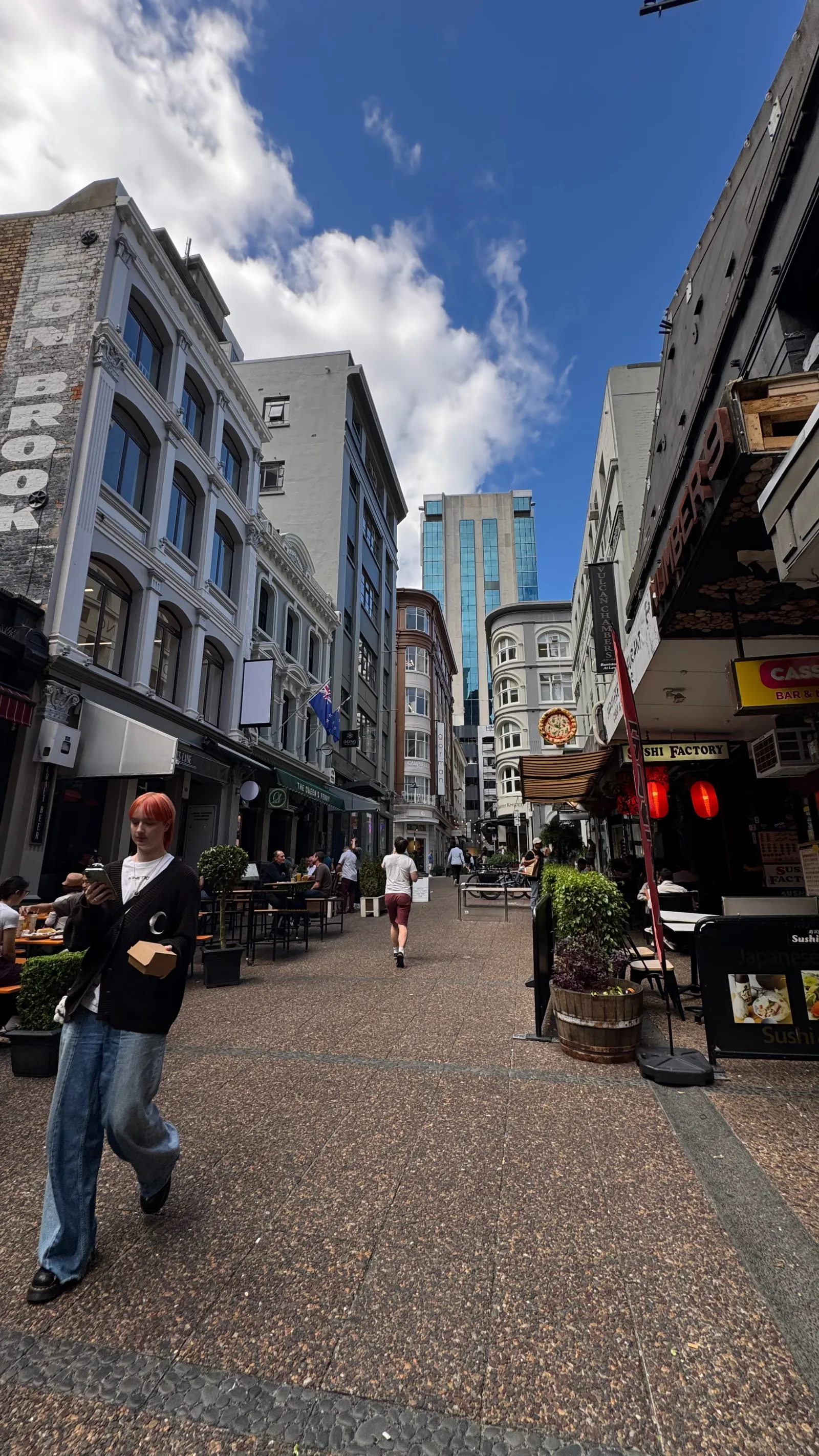 Vulcan Lane, a lively pedestrian lane of cafés and bars in central Auckland.