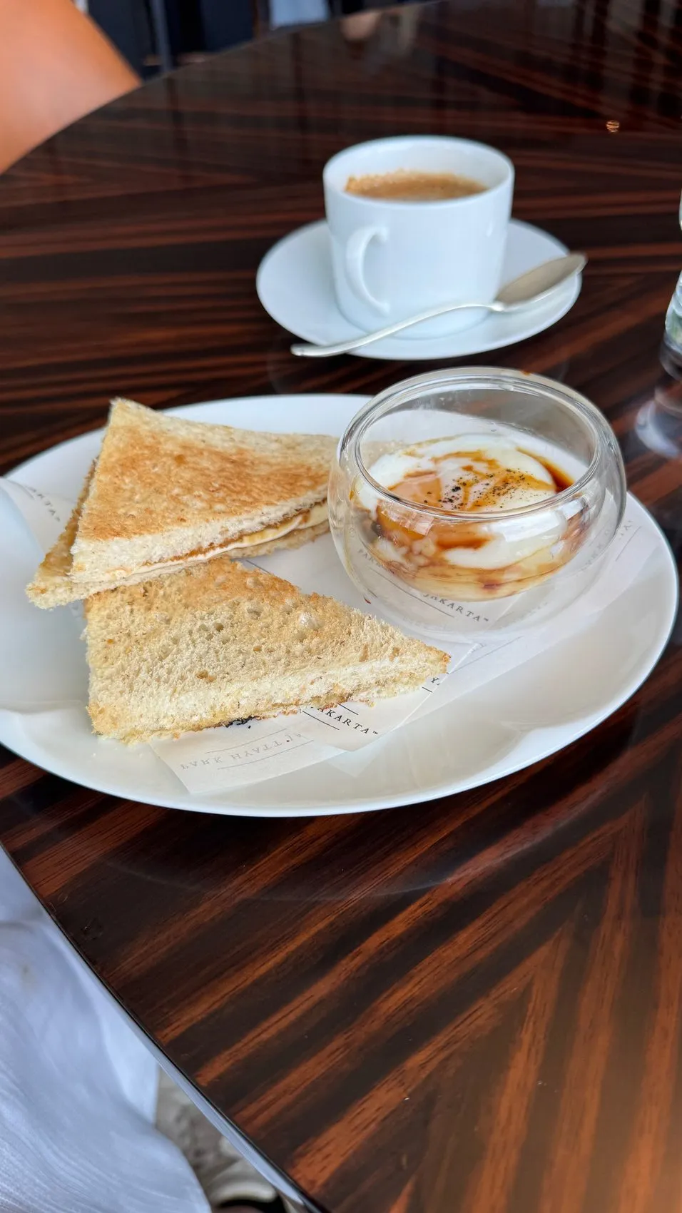 A really nicely plated egg-and-toast breakfast, with coffee on the side.